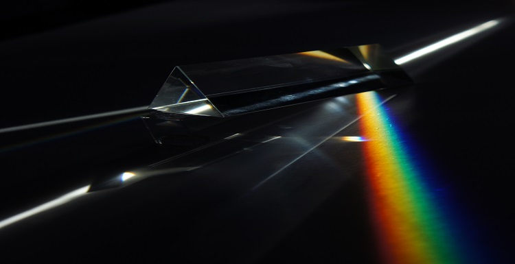 Dispersion of light (photons) by a prism.